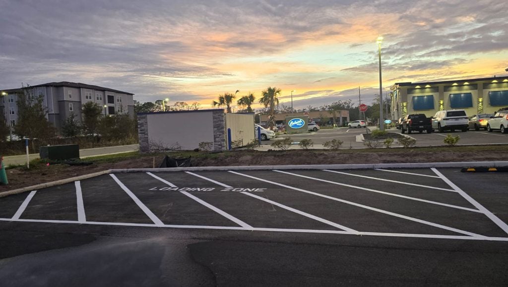 cross walk markings freshly painted for business parking lot