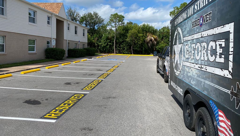 apartment numbers striped on asphalt