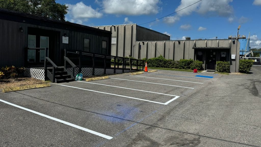 freshly painted yellow line markings for business parking lot