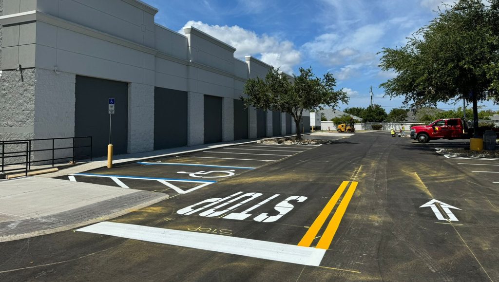 yellow fresh lines and "stop" painted freshly on walmart parking lot