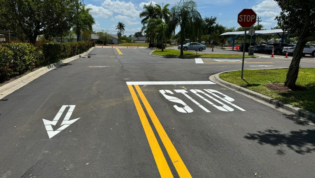 close-up view of fresh painted parking lot arrows for walmart