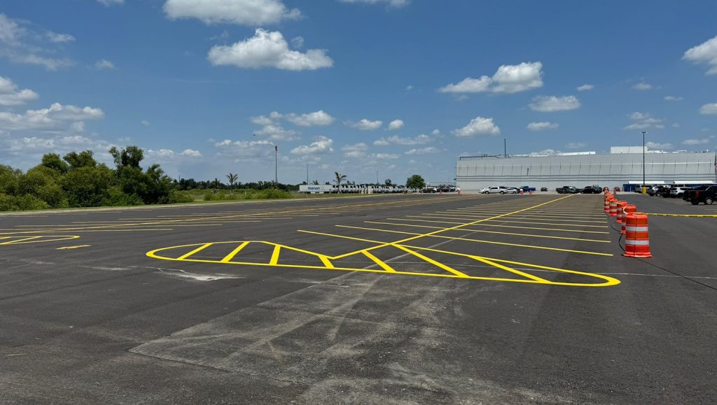 exterior view of walmart warehouse parking lot with freshly painted lines