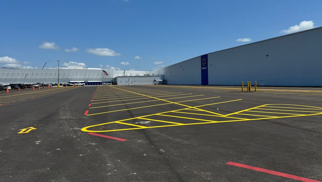 walmart warehouse parking lot with yellow freshly painted lines