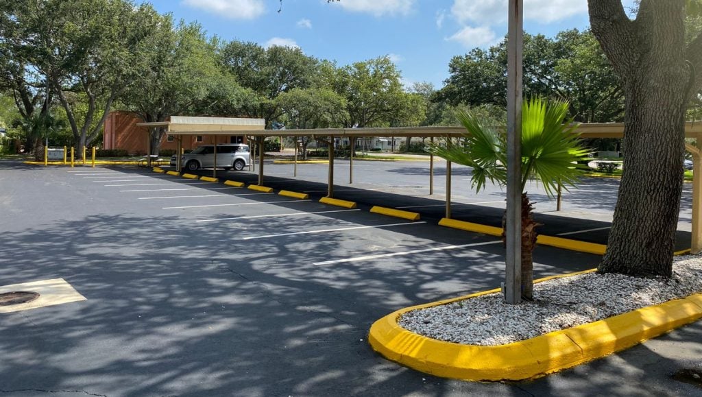 yellow curb painting and wheel stops