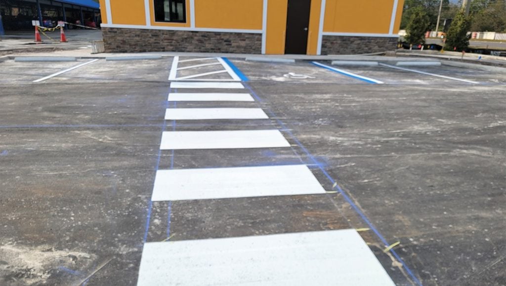 close-up of crosswalk freshly painted for Coffee Shop parking lot
