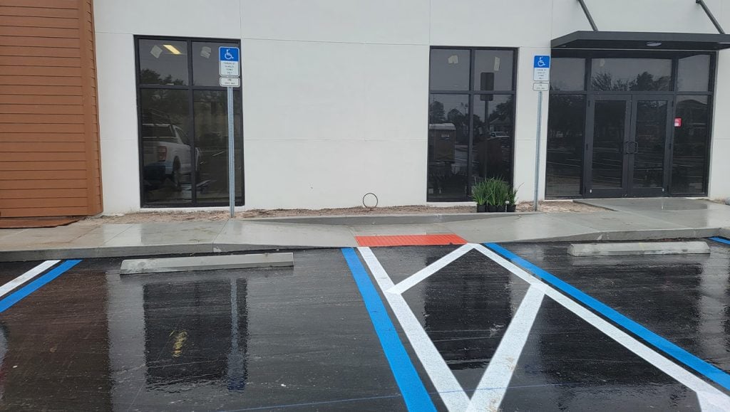 strip mall parking lot ada compliance parking spots freshly painted