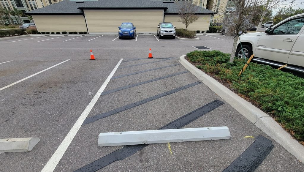 close-up of parking stops installed for apartment complex
