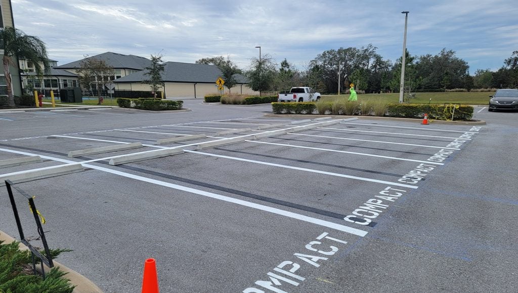 apartment complex parking lot with freshly painted parking spots