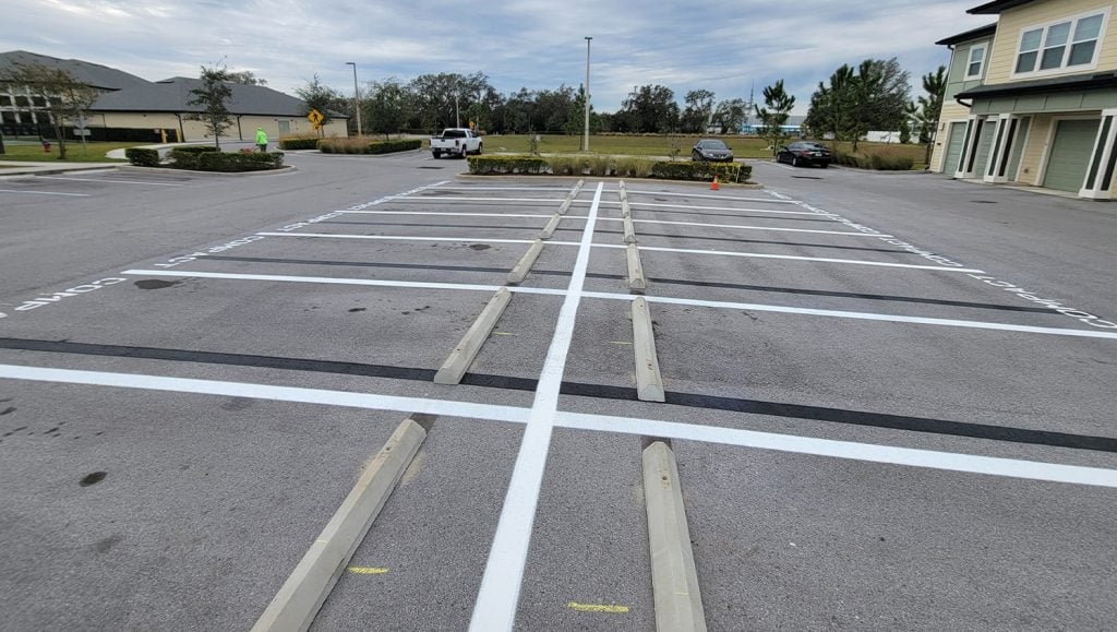 apartment complex parking lot with freshly painted line markings