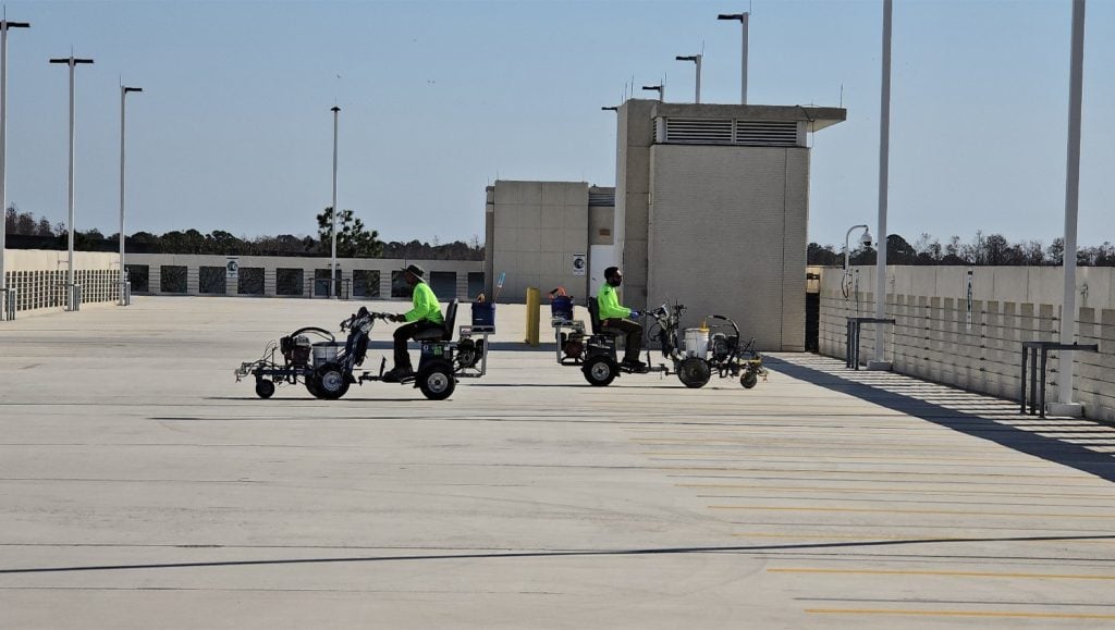 close-up of G-FORCE® employees line striping USAA