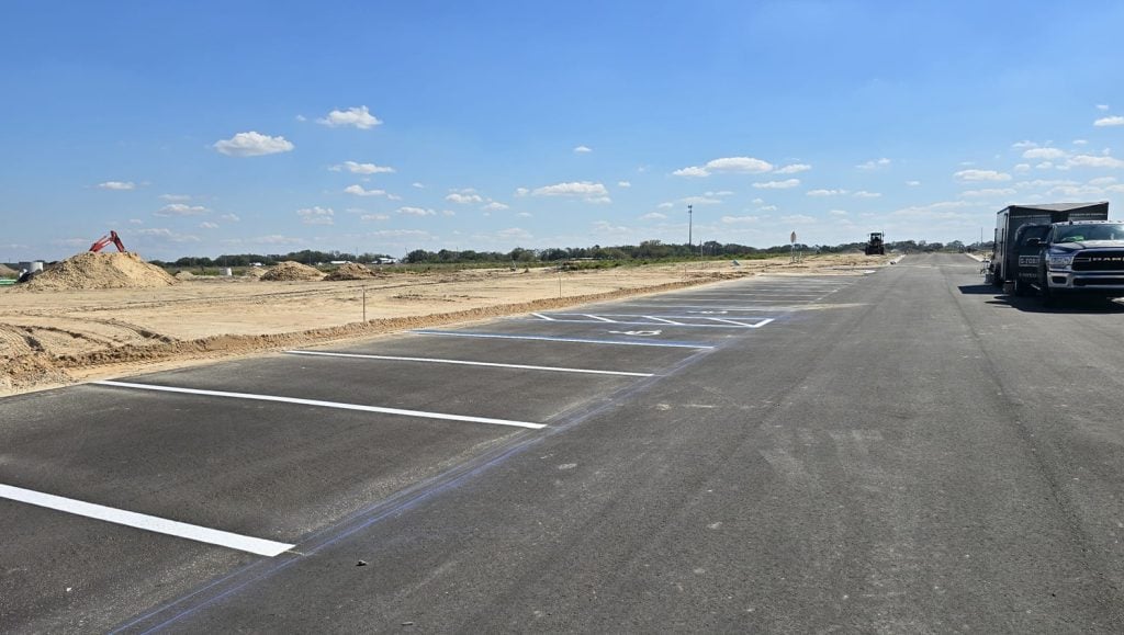 parking spots freshly painted for new development parking lot