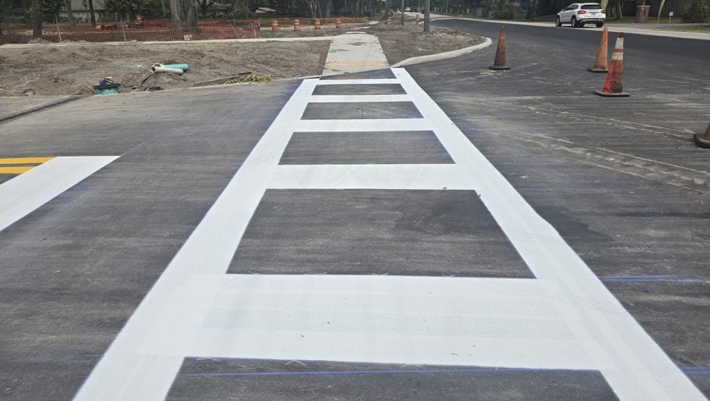 close-up of a crosswalk freshly painted for business parking lot