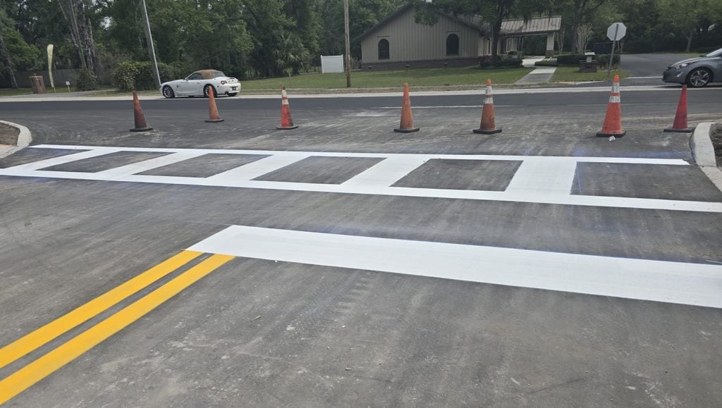 crosswalk freshly painted for business parking lot
