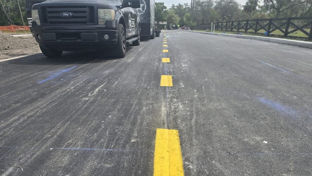 yellow dotted lines freshly painted for business parking lot