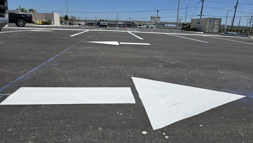 close-up white arrows freshly painted for Home 2 Suites
