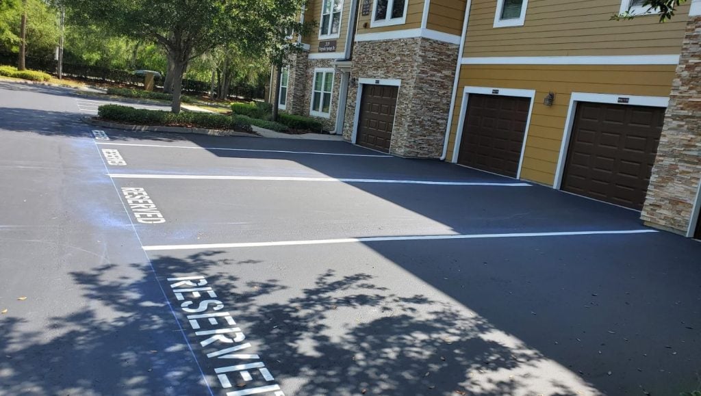 apartment complex with freshly painted reserved parking spots