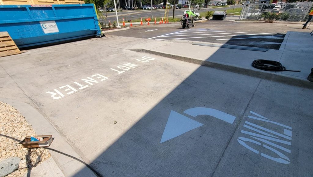 line markings freshly painted for Aguasonic Car Wash parking lot