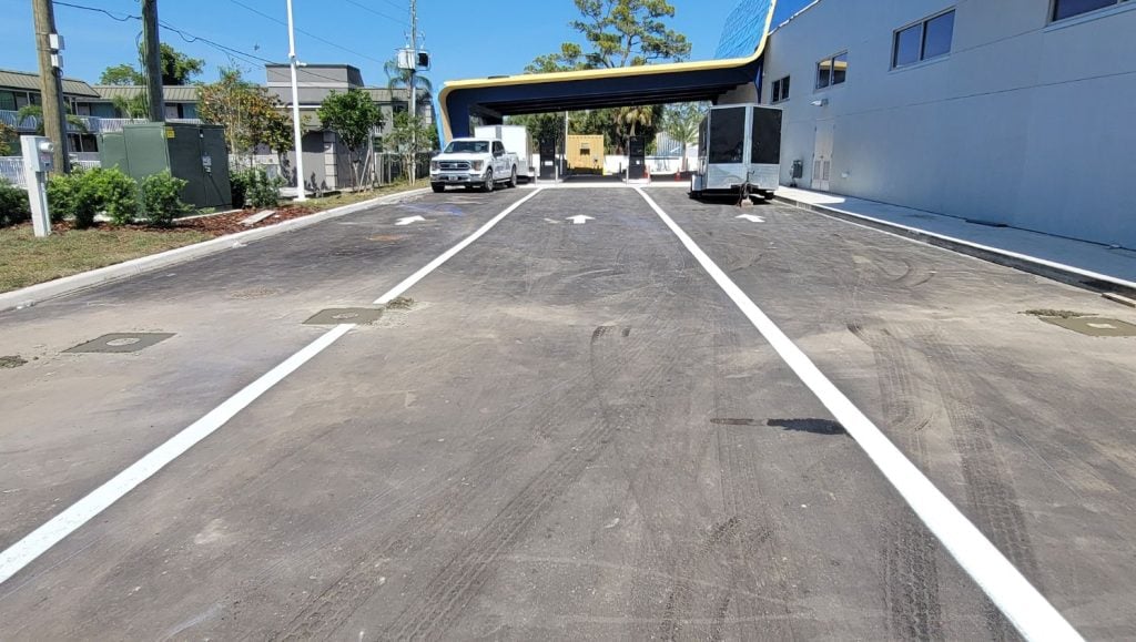 Aguasonic Car Wash parking lot with line striping freshly painted