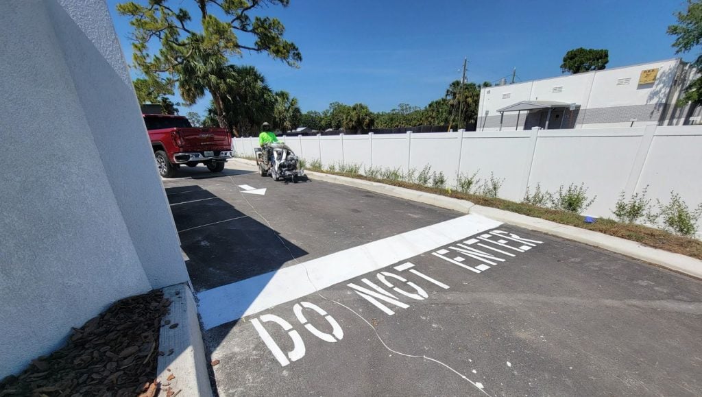 do not enter freshly painted for xAguasonic Car Wash parking lot