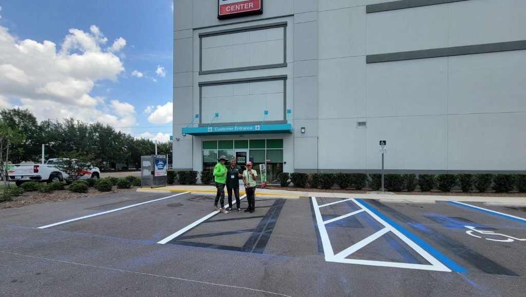G-FORCE® employees smiling in front of building