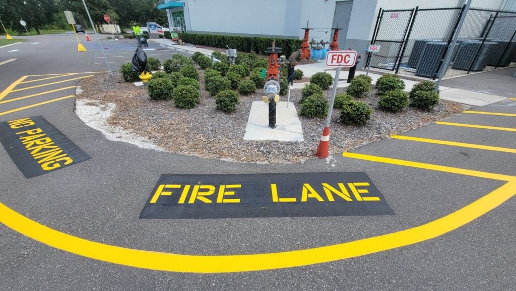 fire lane markings freshly painted for U-Haul parking lot