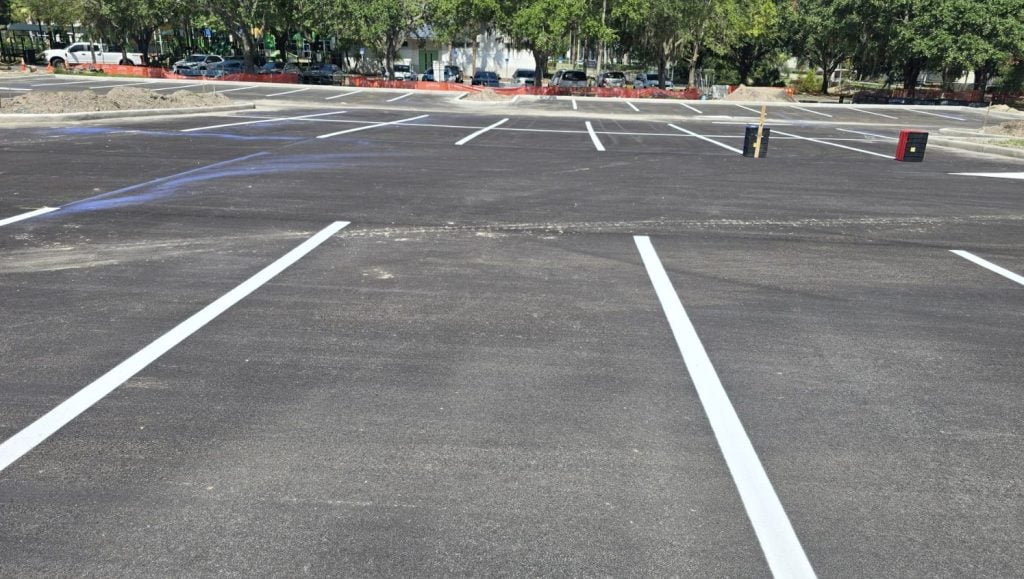 close-up of parking spots freshly painted for All People's Park parking lot