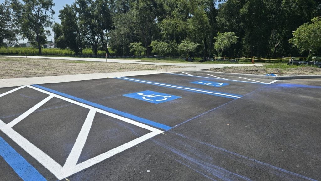 ada compliance parking spot freshly painted for All People's Park parking lot