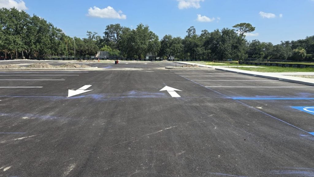 parking spots freshly painted for All People's Park parking lot