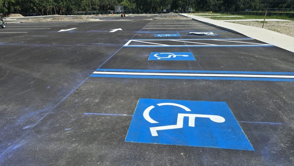 close-up of ada compliance parking spots freshly painted for All People's Park parking lot
