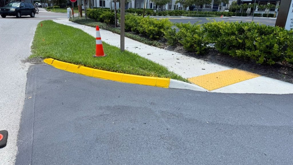 curb freshly painted for Bay to Bay parking lot