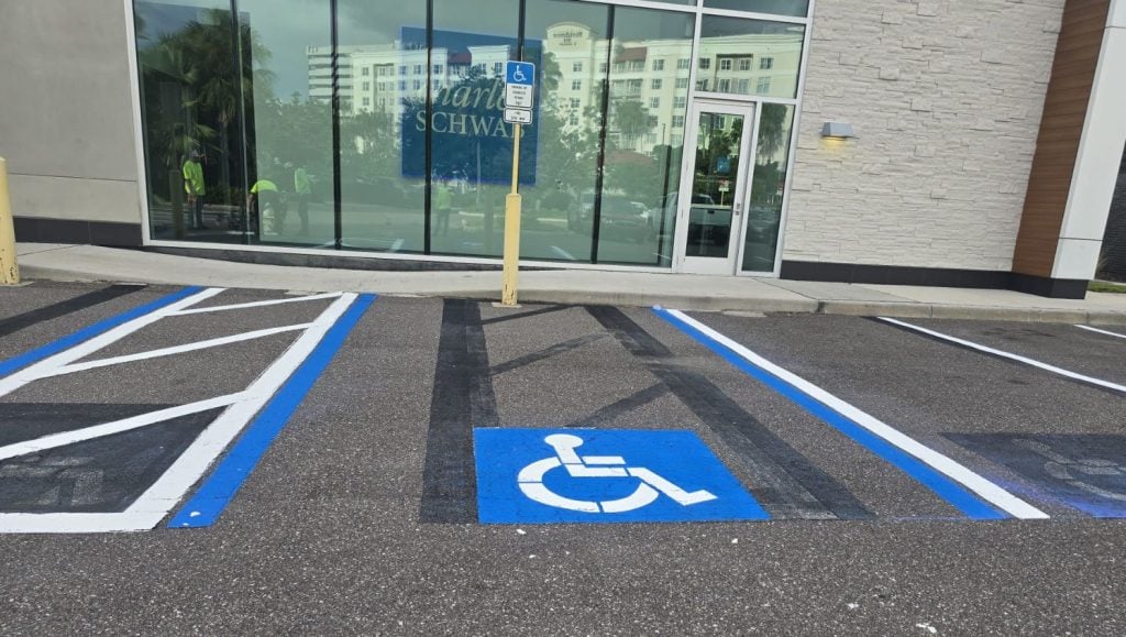front view of ada compliance parking spots freshly painted close-up