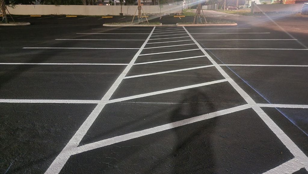 crosswalk freshly painted for O'Reilly's Auto Parts and shopping center parking lot