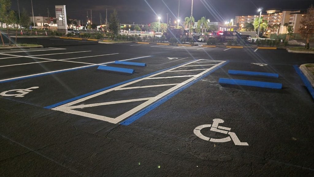 ada compliance parking spots freshly painted for O'Reilly's Auto Parts and shopping center parking lot