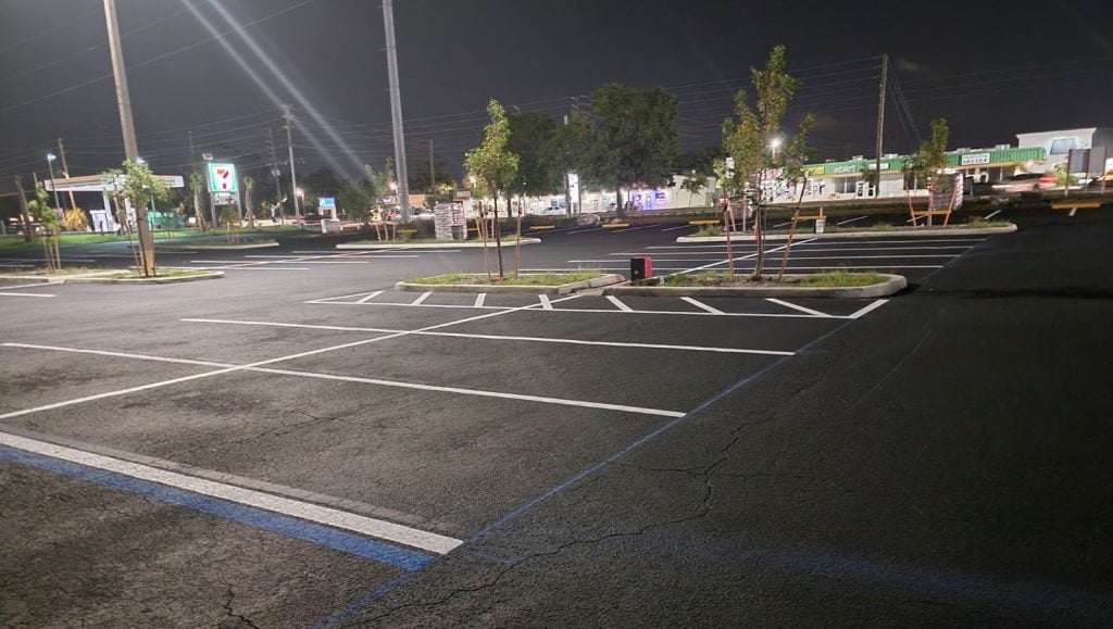 O'Reilly's Auto Parts and shopping center parking lot freshly painted