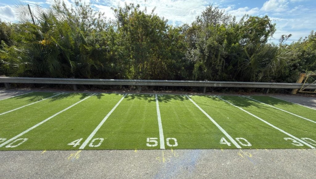 football field line markings freshly painted for business parking lot