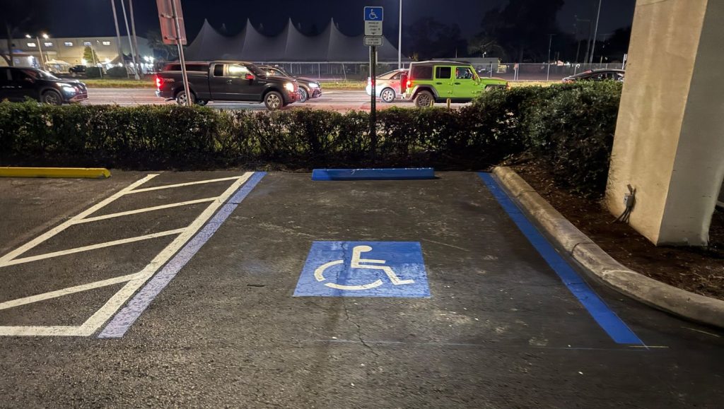 ada compliance parking spot freshly painted for Jiffy Lube parking lot