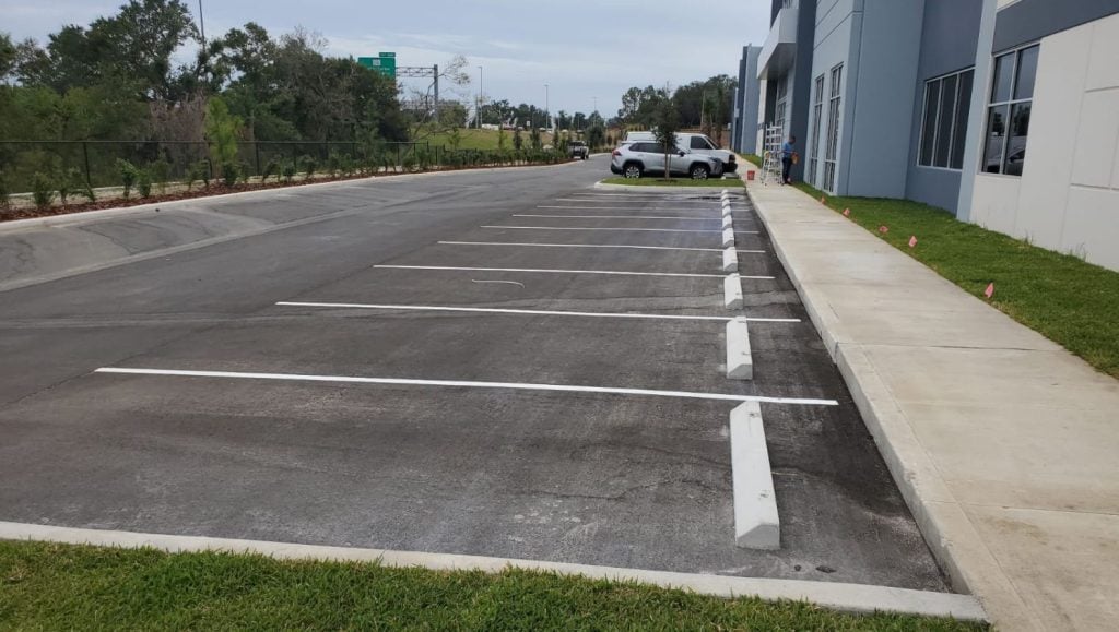 parking stops installed for business parking lot side view