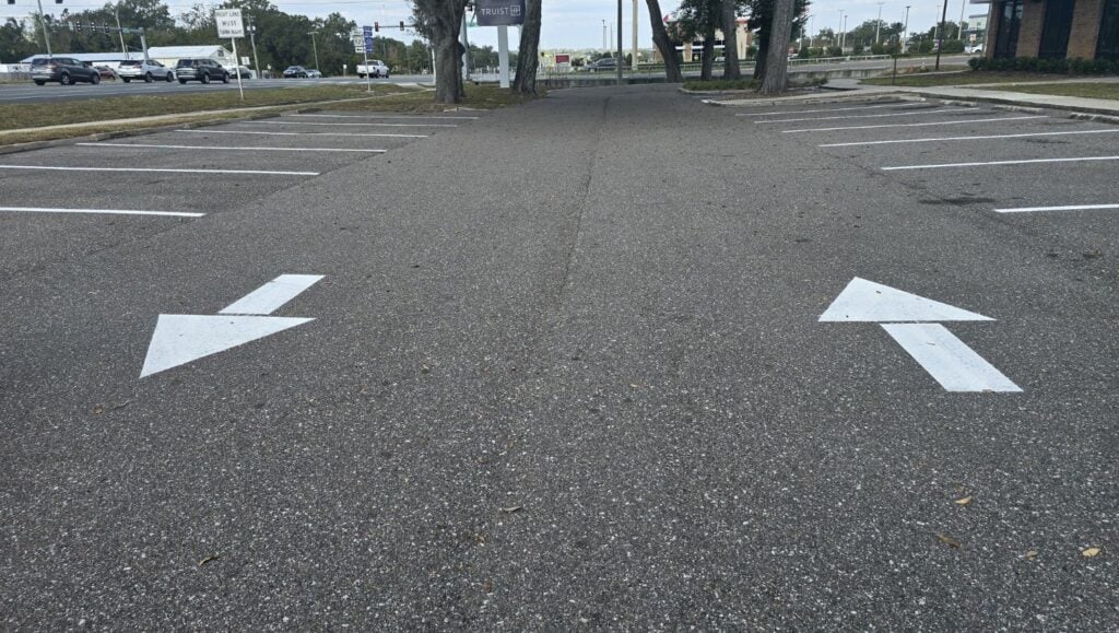 white arrows freshly painted for truist Bank parking lot