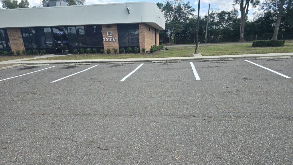 front view of Truist Bank parking lot freshly painted