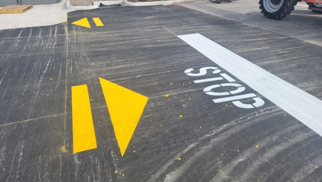 freshly painted yellow and white line markings for Wendy's parking lot
