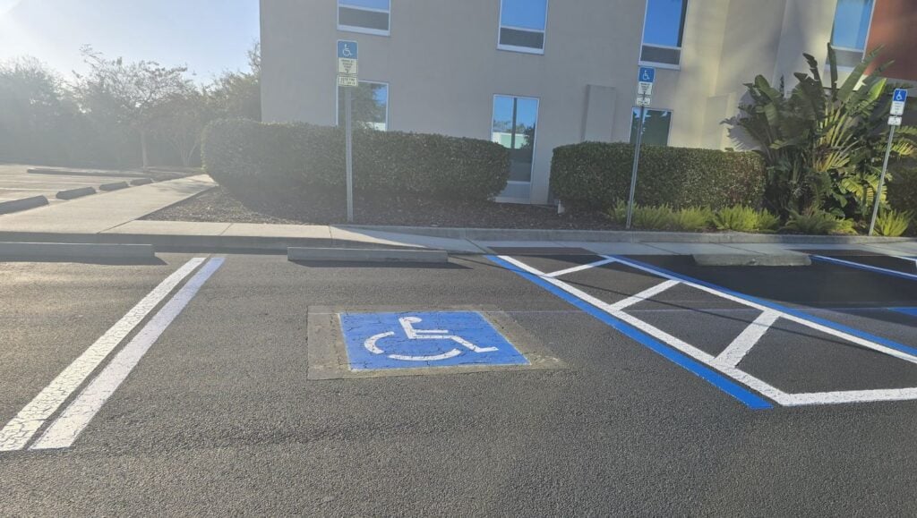 ada compliance parking spot freshly painted for Hotel Parking Lot