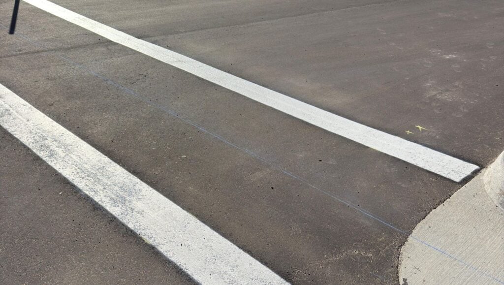 crosswalk freshly painted for new business parking lot