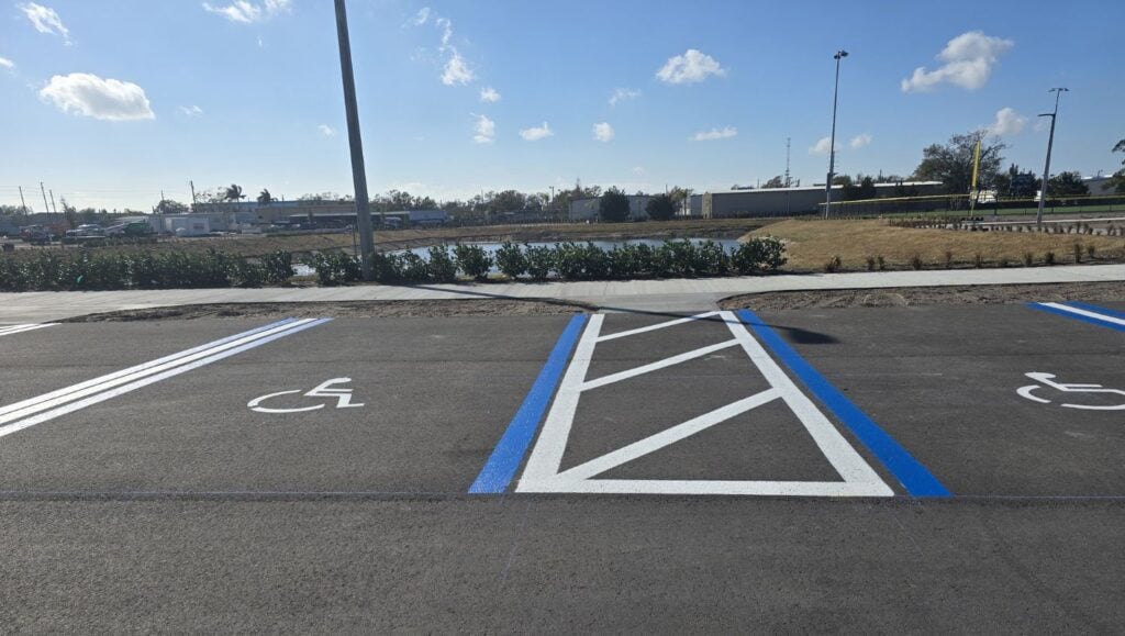 ada compliance parking spots freshly painted for Sports Complex parking lot