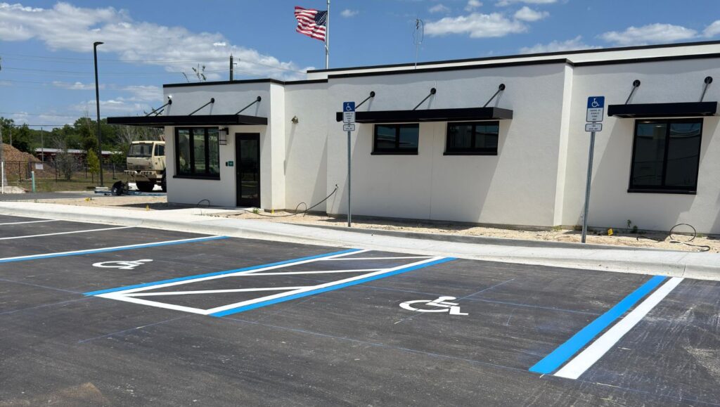 close-up of ada compliance parking spots freshly painted for new business