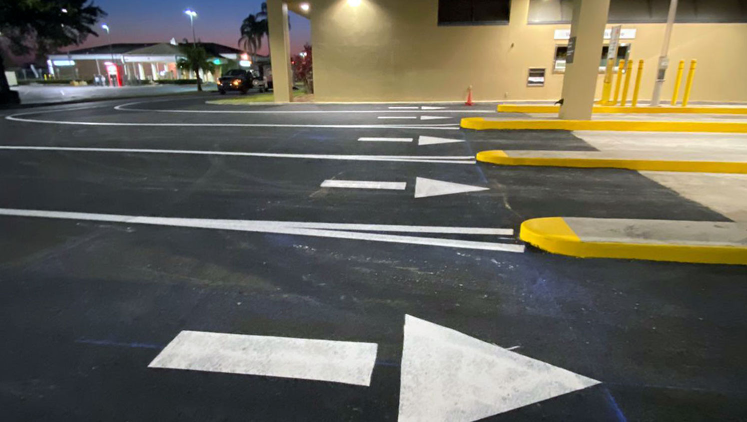 close up of updated banking drive-thru entrance lines and arrows at Wells Fargo in Sun City Center, FL