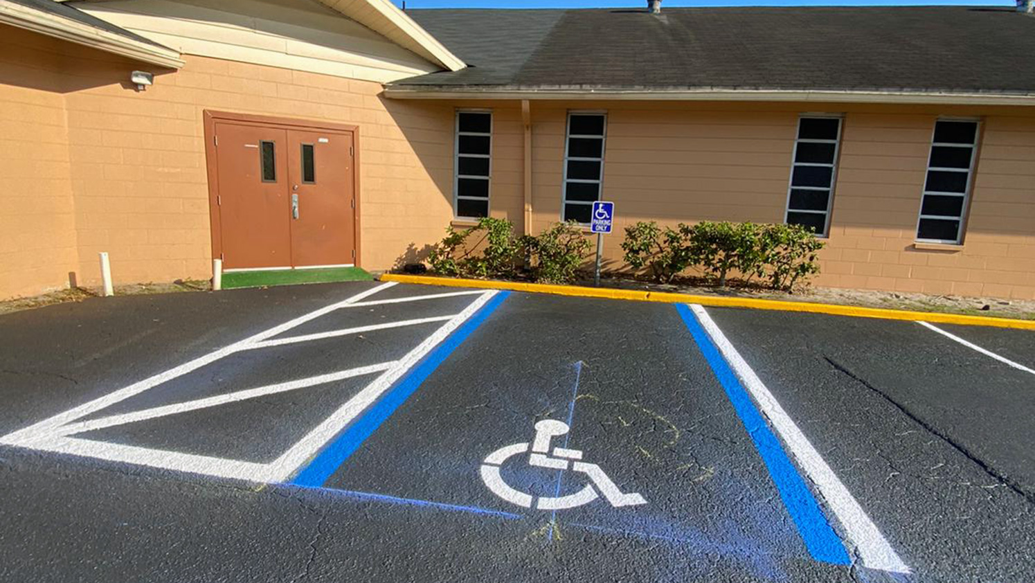 new ADA accessible stalls striped at a Lakeland, FL church