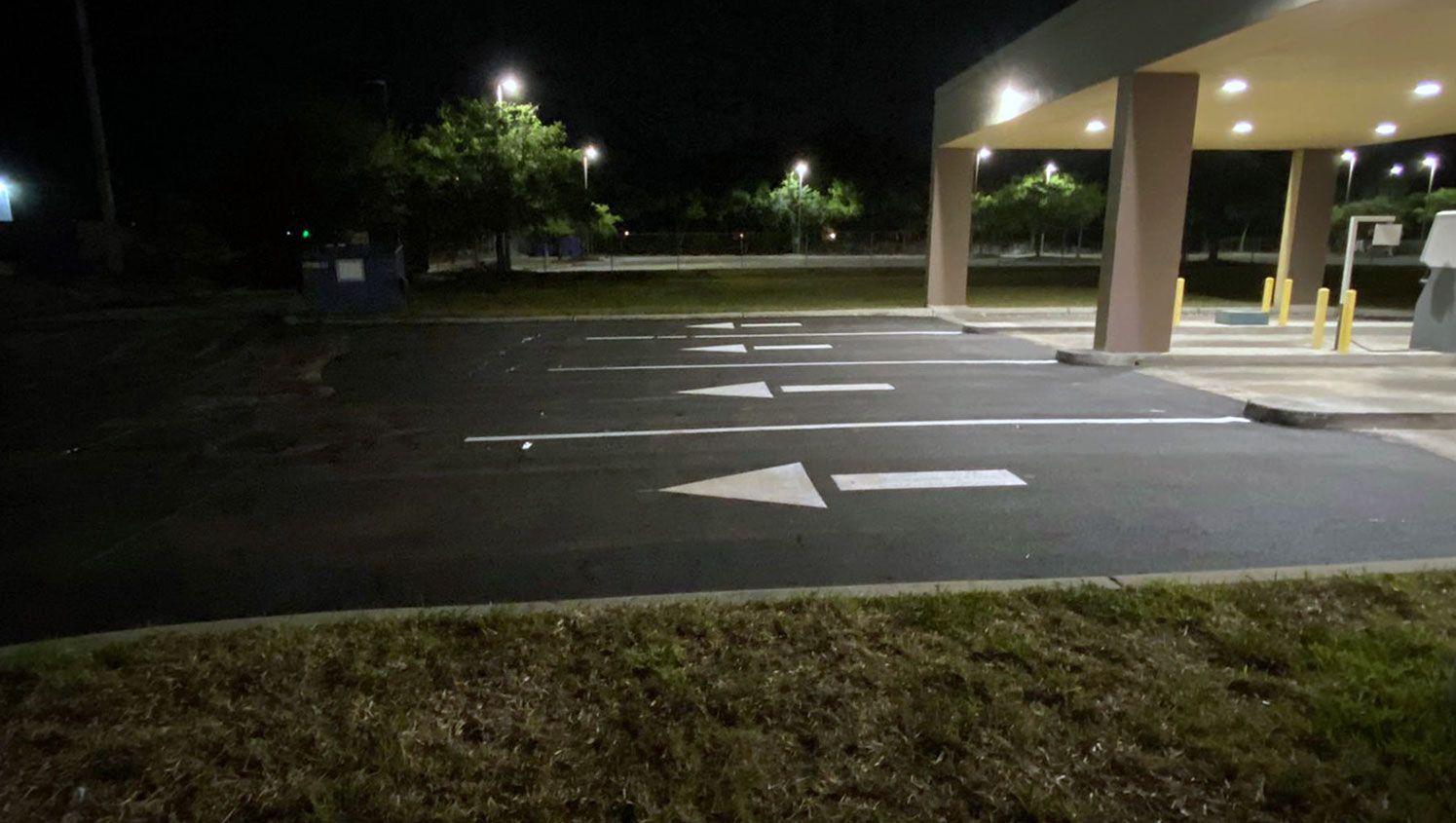 updated patron parking space line striping and curb safety paint at Wells Fargo in Tampa, FL