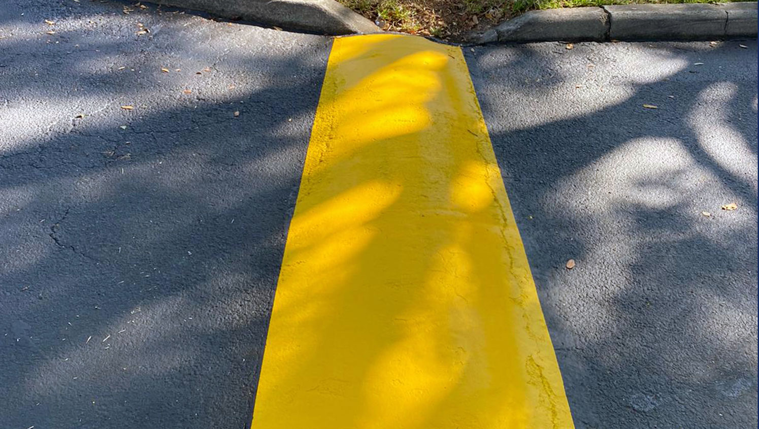 re-striped safety paint over speed bumps in Tampa, FL