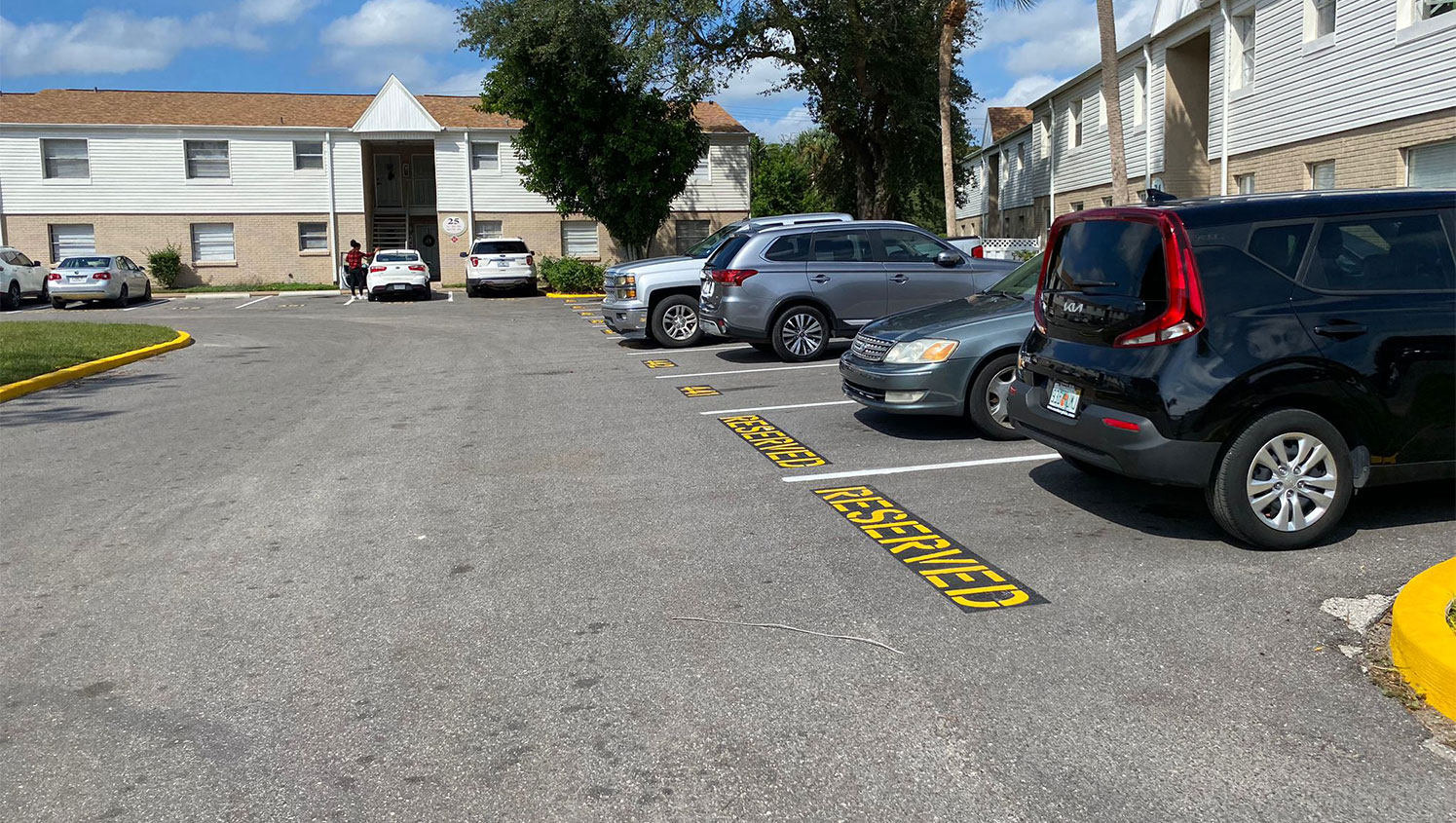 reserved parking stencil painted on asphalt