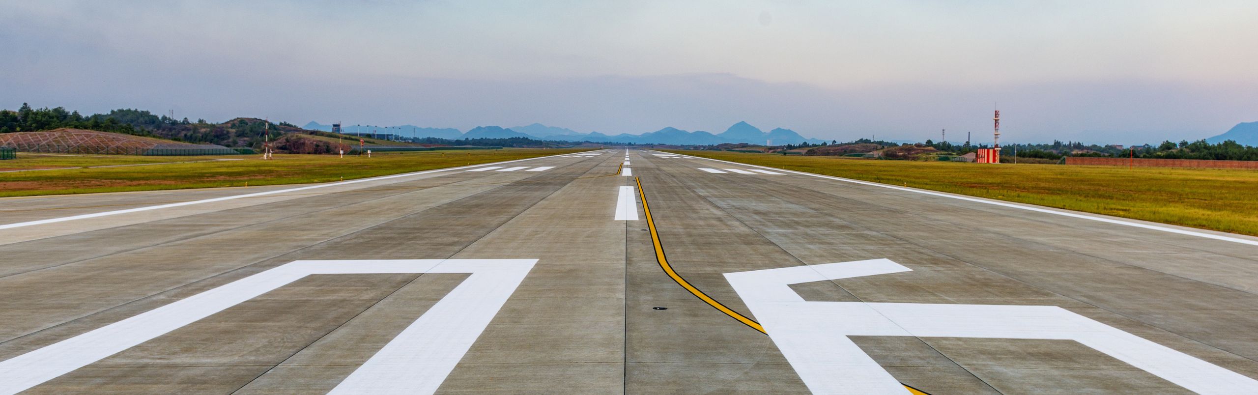 new airport runway markings striped on pavement